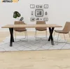 A dining table with chairs in a room setting, displayed on a rug with framed pictures on the wall. Náhľad obrázku produktu