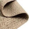 A close-up of a woven rug, showing its texture and edge. Náhled obrázku produktu