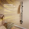 A modern black towel warmer with a tree design, a towel hanging on it, and text overlay describing its features. Produktbild-Vorschau