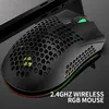 A close-up, angled shot of a black gaming mouse with a honeycomb design and RGB lighting, placed on a dark surface next to a laptop. Produktbild-Vorschau