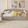 A daybed with pillows and blankets in a room with abstract art on the wall. Produktbild-Vorschau