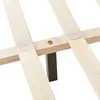 Close-up of a wooden bed frame with a dark leg. Produktbild-Vorschau