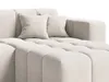 A close-up view of a cream-colored sectional sofa with two throw pillows. Produktbild-Vorschau