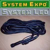 A coiled black cable with connectors on a wooden surface, with marketing text above. Produktbild-Vorschau