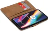 A book-style phone case with cards inserted, showing a smartphone screen. Náhled obrázku produktu