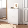 A white shoe cabinet with two drawers is shown in a room with a mirror and a door. Náhľad obrázku produktu