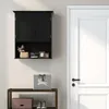 A black wall-mounted cabinet with an open shelf is shown next to a white door. Podgląd zdjęcia produktu