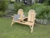 A wooden bench with an integrated table sits on a grassy lawn in a garden setting. Produktbild-Vorschau