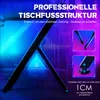 A close-up view of the Y-shaped leg structure of a gaming desk, with blue and purple lighting. Voir les images du produit