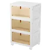 A white, three-tiered storage box with amber, ribbed doors and brown handles, shown against a white background. Voir les images du produit
