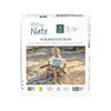 A package of diapers with a child sitting on a rock. Produktbild-Vorschau