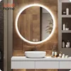 A modern bathroom vanity with a round, illuminated mirror above a white sink. Náhled obrázku produktu