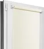 A close-up view of a cream-colored roller blind installed in a white window frame. Náhľad obrázku produktu