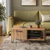 A living room scene with a couch, coffee table, and rug. Anteprima dell’immagine prodotto