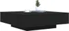A black coffee table with a plant and a cup on top, isolated on a white background. Produktbild-Vorschau