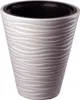 A close-up studio shot of a beige and white patterned plant pot with a black inner liner. Anteprima dell’immagine prodotto