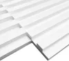 A close-up, angled view of white 3D decorative panels with a ribbed texture, arranged in a grid pattern. Produktbild-Vorschau