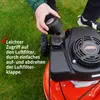 A person is shown removing the air filter cover from a lawnmower. Produktbild-Vorschau