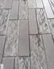 A close-up view of textured wall panels arranged in a brick-like pattern. Náhľad obrázku produktu