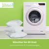 Three white pillows are stacked in front of a white washing machine against a bright green wall. Náhled obrázku produktu