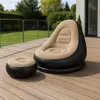 An inflatable chair and ottoman set on a wooden deck with a backyard in the background. Produktbild-Vorschau