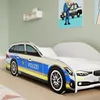 A child's bed designed to look like a police car, placed in a bedroom setting with wall decorations. Náhled obrázku produktu