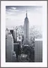 A framed black and white photograph of the Empire State Building and surrounding New York City skyline. Produktbild-Vorschau