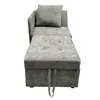 A gray sofa bed with an ottoman and a pillow, shown from the front. Produktbild-Vorschau