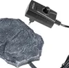 A close-up shot of a reptile heating rock and its temperature controller. Anteprima dell’immagine prodotto