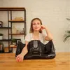 A woman is posing with a foot and leg massager. Náhľad obrázku produktu