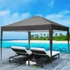 A pop-up canopy tent set up on a wooden deck next to a tropical beach. Voir les images du produit
