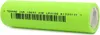 A single green battery with black text and a barcode printed on it, lying on a white background. Produktbild-Vorschau