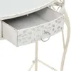 A close-up view of an open drawer on a white table. Produktbild-Vorschau