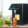 A quantitative fructose dispenser is shown in use, dispensing liquid into a cup of grapefruit slices. A glass of green smoothie and apples are also visible. Náhled obrázku produktu