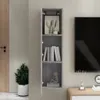 A narrow wall-mounted cabinet with shelves, displaying decorative items and books, next to a door and a plant. Produktbild-Vorschau