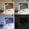 A collage of four images showing a white LED desk lamp with a digital display in different lighting conditions. Anteprima dell’immagine prodotto