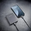 A smartphone is being charged by a power bank. Produktbild-Vorschau