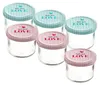 A group of six small glass jars with decorative lids. Anteprima dell’immagine prodotto
