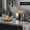 A toaster on a kitchen counter with toast, orange juice, and eggs. Voir les images du produit