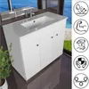 A white bathroom vanity with a sink and faucet is shown in a room with a window overlooking the ocean and a grassy area. Náhled obrázku produktu