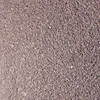 A close-up, overhead view of small, dark brown and gray gravel. Produktbild-Vorschau
