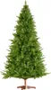 A green artificial Christmas tree on a wooden stand, presented against a white background. Náhled obrázku produktu
