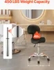 A black stool with a chrome base and wheels, shown in a salon-like setting with hair chairs and a mirror in the background. A close-up of the gas lift cylinder is also shown. Anteprima dell’immagine prodotto