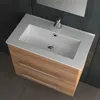 A modern bathroom vanity with a sink and two drawers, set against a dark tiled wall. Produktbild-Vorschau