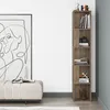 A tall, narrow bookshelf is shown in a room next to a large framed artwork and a bench. Voir les images du produit