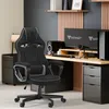 A gaming setup with a chair, desk, and computers. Anteprima dell’immagine prodotto