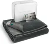 A folded blanket is displayed in front of its packaging, with a small product image card placed on top. Produktbild-Vorschau