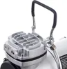 Close-up of the top part of an airbrush compressor, showing the handle and the cooling fins on the compressor head. Podgląd zdjęcia produktu