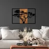 A metal wall art of an acacia tree is displayed on a dark gray wall above a sofa with pillows and a coffee table. Anteprima dell’immagine prodotto