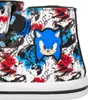 A close-up view of a sneaker with a graffiti-style print and a Sonic the Hedgehog character patch. Voir les images du produit